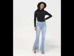 Load and play video in Gallery viewer, Distressed Flare Jeans
